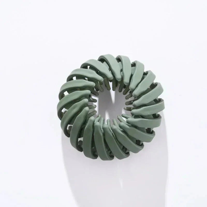 Clarivae bird nest shaped ponytail hair clip, a magic lazy braider hairpin for effortless hairstyles, shown in a close-up image.