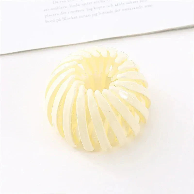 Clarivae bird nest shaped ponytail hair clip with a bird nest design, easy-to-use hairpin for effortless hairstyles.