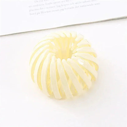 Clarivae bird nest shaped ponytail hair clip with a bird nest design, easy-to-use hairpin for effortless hairstyles.