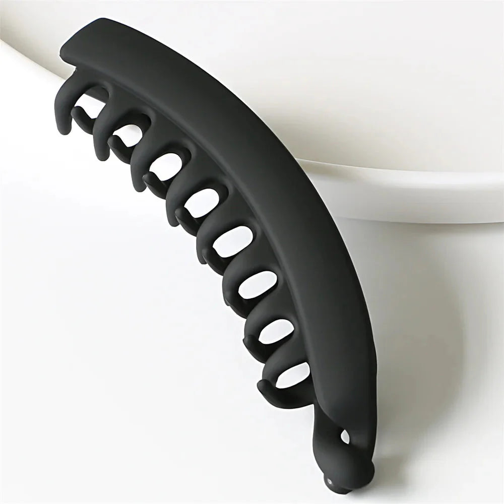 Clarivae frosted solid color banana hair clips, stylish ponytail barrettes and hair claws for women in various colors.