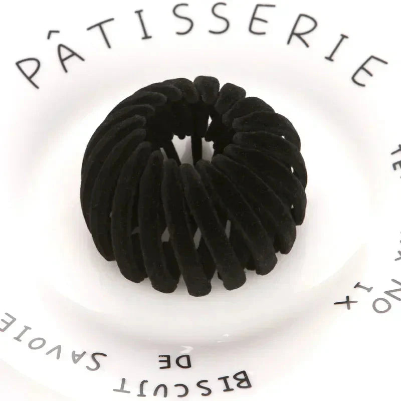 Clarivae bird nest shaped ponytail hair clip with a lazy braid design for effortless hairstyles, shown in a close-up image.
