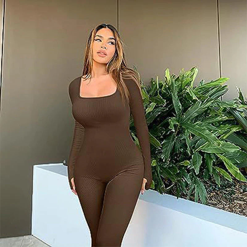 Women's Clarivae seamless long-sleeve yoga jumpsuit, lightweight and fitted, shown on a model in a flexible pose.