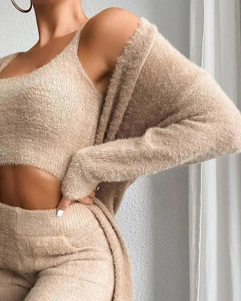 Clarivae 3-piece fuzzy fleece loungewear set with cozy matching top, pants, and shorts in soft, plush fabric for comfortable relaxing wear.