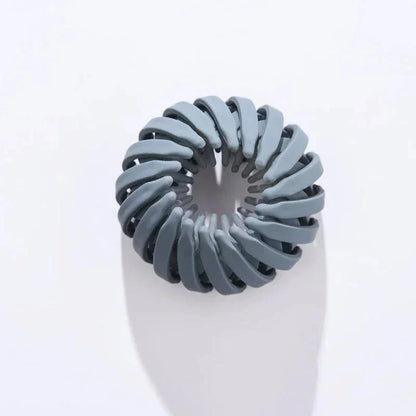 Clarivae bird nest-shaped ponytail hair clip, a playful hairpin for easy, stylish ponytail hairstyles.