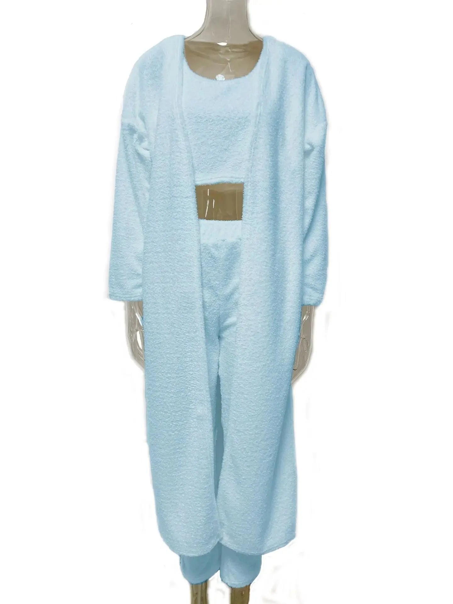 Soft, cozy Clarivae 3-piece fuzzy fleece loungewear set with matching top, pants, and shorts, perfect for comfortable relaxation.